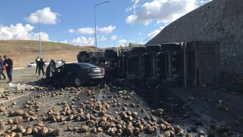 SEMI TRUCK LOADED WITH SUGAR BEETS COLLIDES WITH A CAR IN TRAFFIC ACCIDENT
